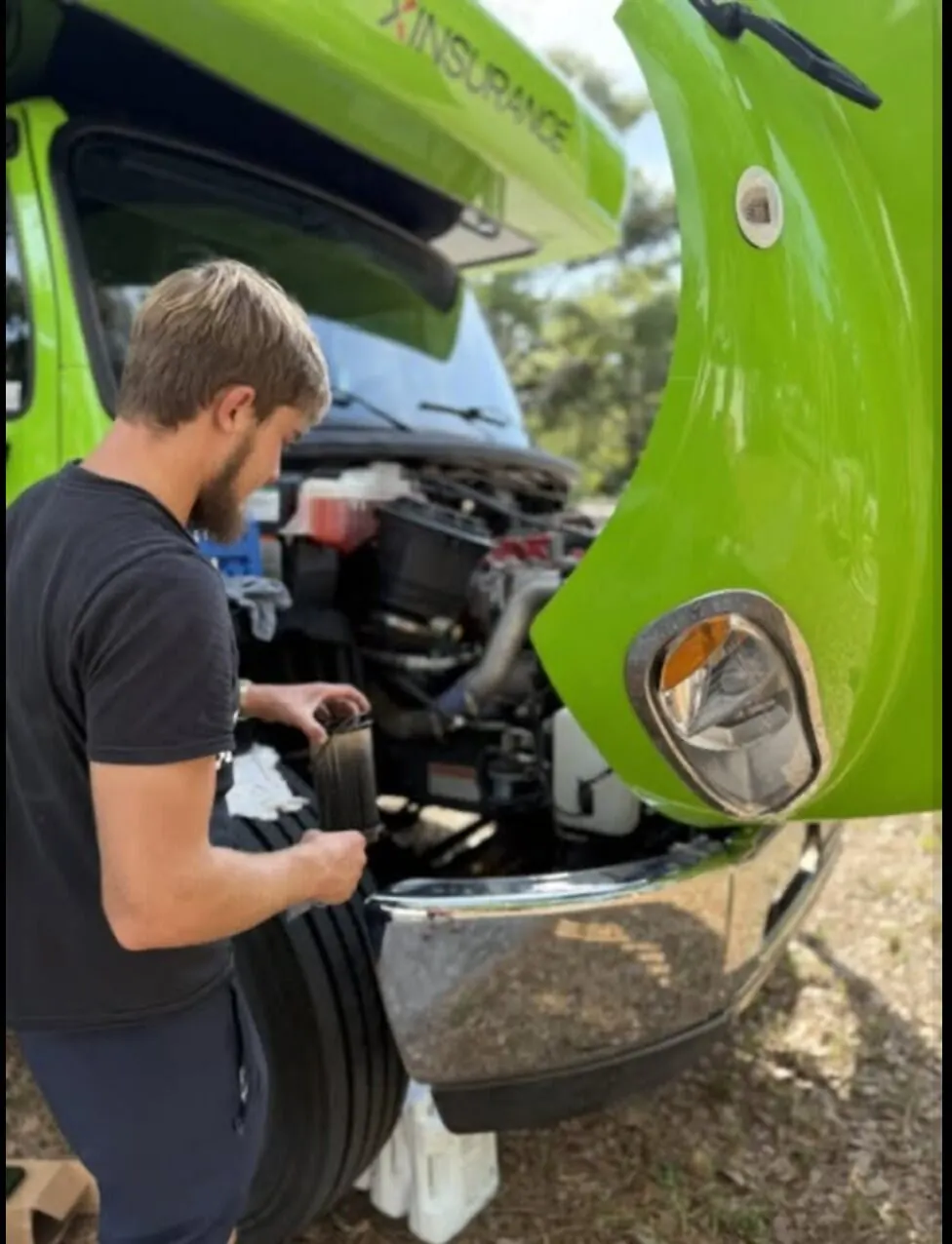 Ethan holding a used filter removed during service