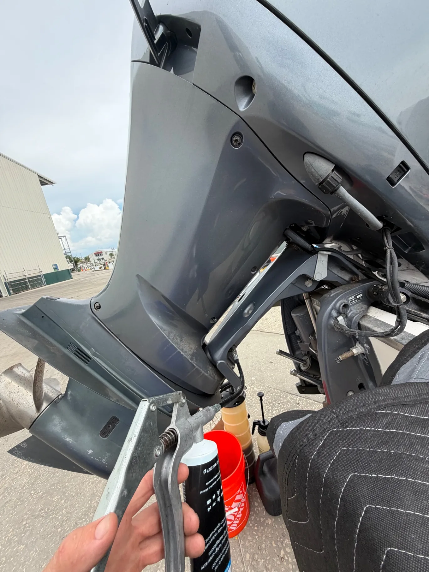 Greasing an outboard swivel bracket during a steering service