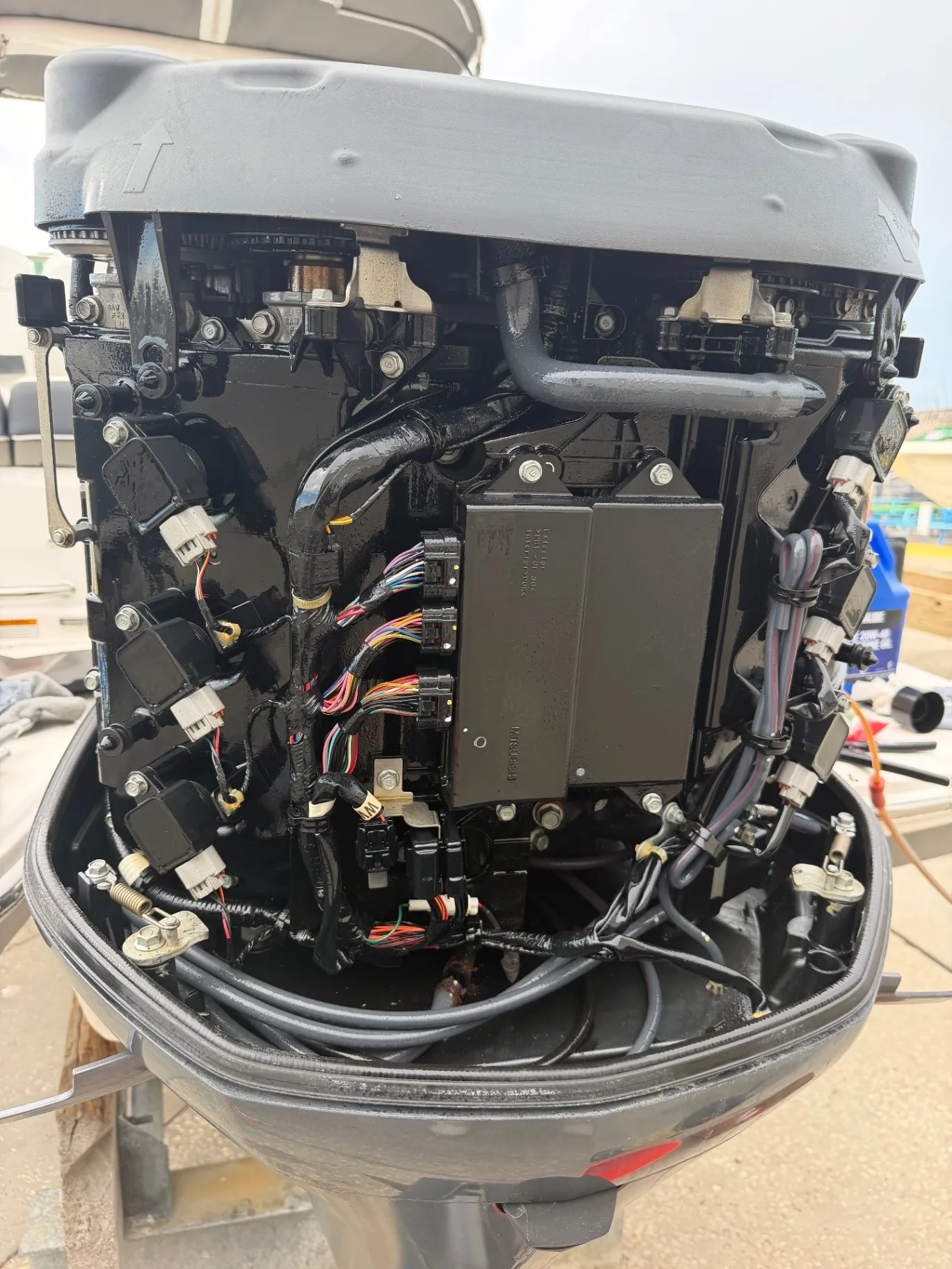 Outboard powerhead wiring harness and control module during an electrical repair