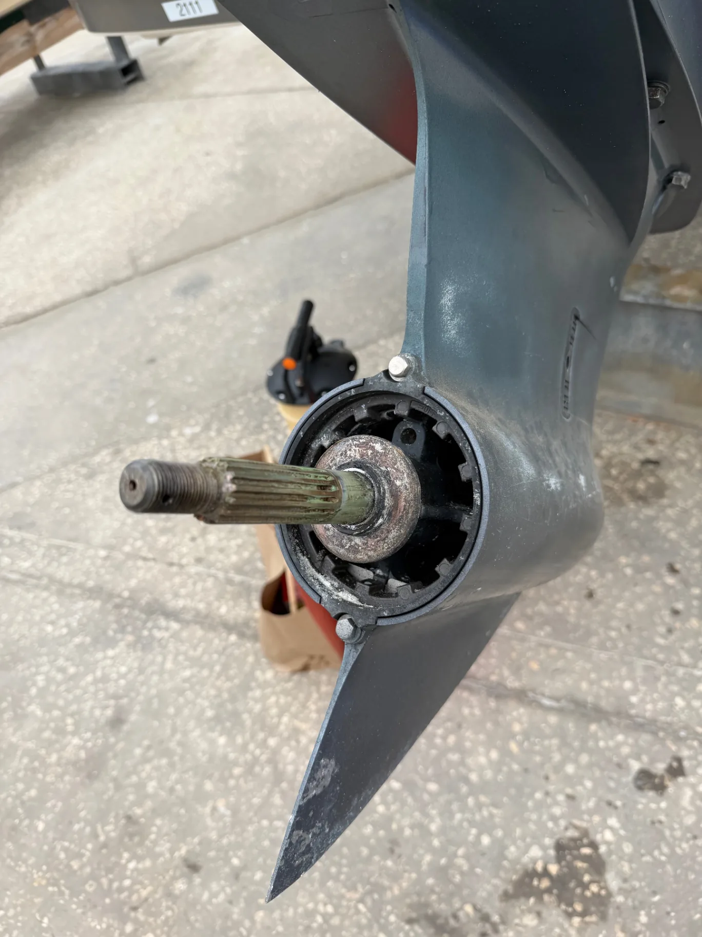 Propeller removed from the gearcase, exposed prop shaft and bearing during prop and running gear service