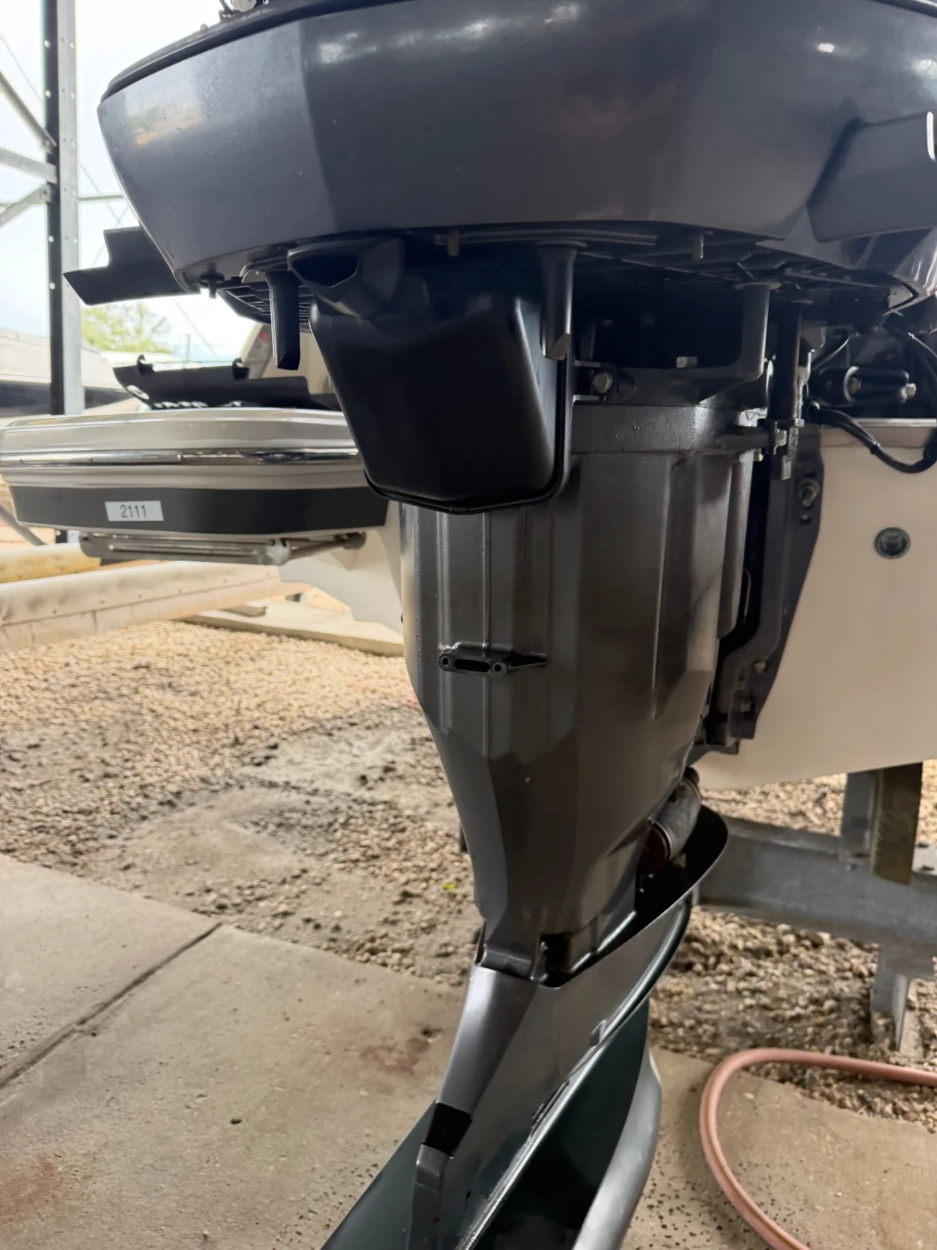 New trolling motor installed on the bow of a boat at the water